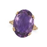 NO RESERVE - AN AMETHYST RING in 9ct yellow gold, set with an oval cut amethyst, full British hal...