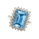 A BLUE TOPAZ AND DIAMOND CLUSTER RING in 9ct yellow gold, set with an octagonal step cut blue top...