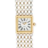 CHANEL - A LADIES CHANEL MADEMOISELLE PEARL WRISTWATCH in 18ct yellow gold, E.G.33729, c.1990s, t...
