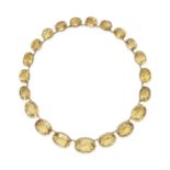 AN ANTIQUE VICTORIAN CITRINE RIVIERE NECKLACE in yellow gold, set with a row of graduating oval c...