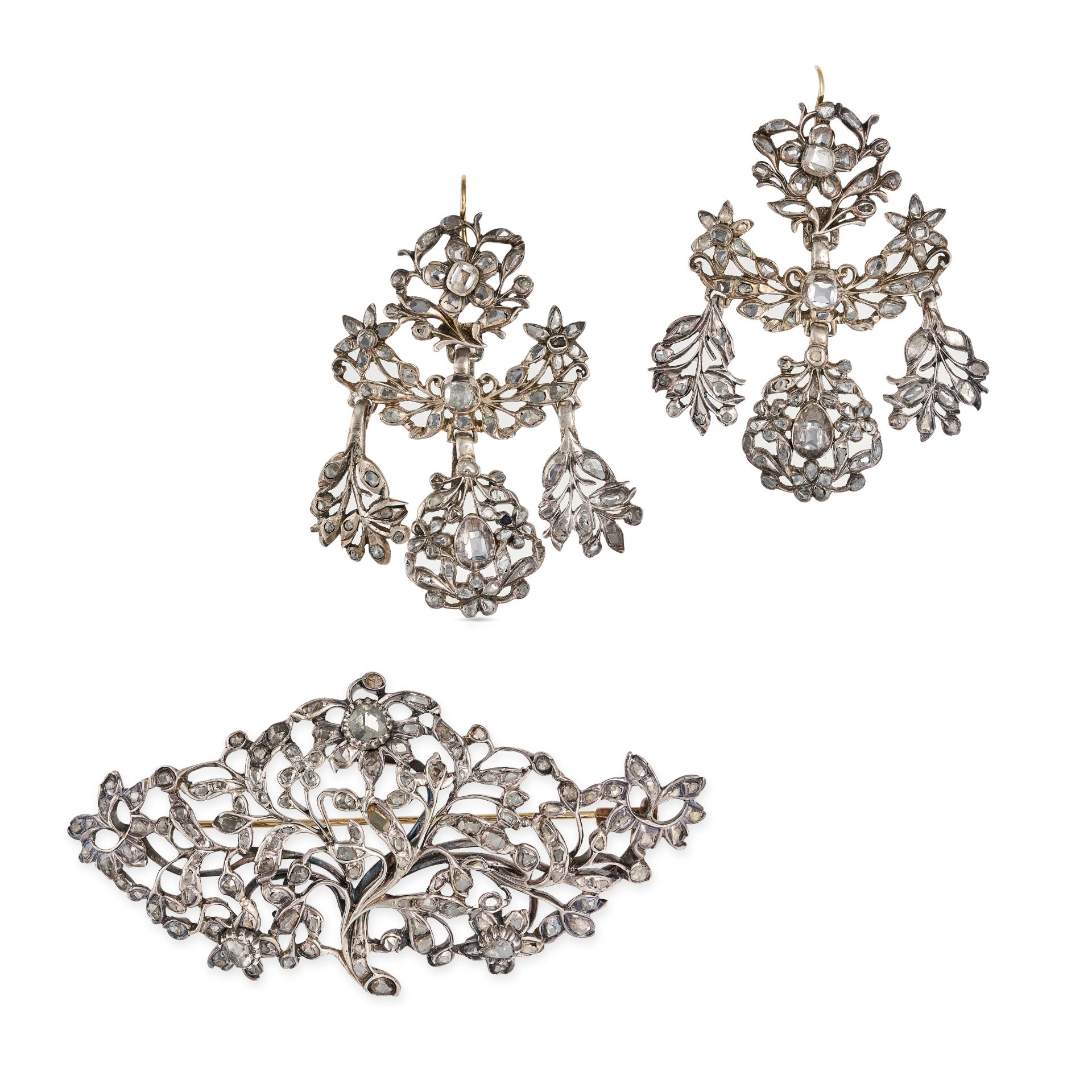 A FINE ANTIQUE DIAMOND BROOCH AND EARRINGS SUITE, 18TH CENTURY in silver, the brooch in foliate d...