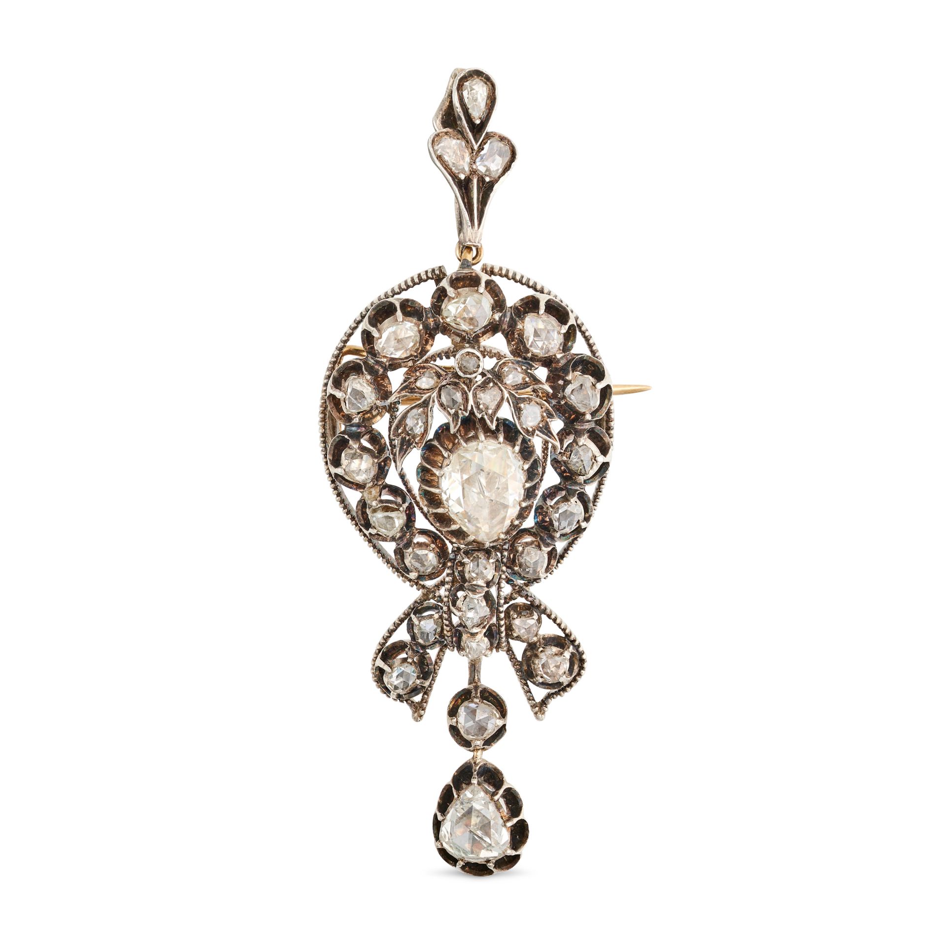 AN ANTIQUE DIAMOND PENDANT / BROOCH in yellow gold and silver, set with a principal pear shape ro...