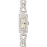 AN ART DECO LADIES DIAMOND COCKTAIL WATCH the rectangular dial with gold tone numerals, the case ...