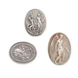 THREE UNMOUNTED SILVER CAMEOS depicting the seal of Nero, Cupid riding a dolphin, and Victory wit...