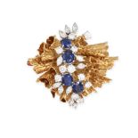 A VINTAGE SAPPHIRE AND DIAMOND BROOCH in 18ct yellow gold, the textured scrolling body set with f...