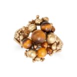 NO RESERVE - A TIGER'S EYE RING in 9ct yellow gold, set with a cluster of polished tiger's eye be...