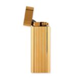 NO RESERVE - LE MUST DE CARTIER, A LIGHTER in gold plate, the lighter decorated with fluted detai...