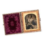 NO RESERVE - A VICTORIAN PHOTOGRAPH CASE in brown leather, opening to reveal a maroon velvet inte...