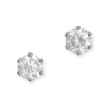 A PAIR OF DIAMOND STUD EARRINGS in platinum, each earring set with a round brilliant cut diamond,...