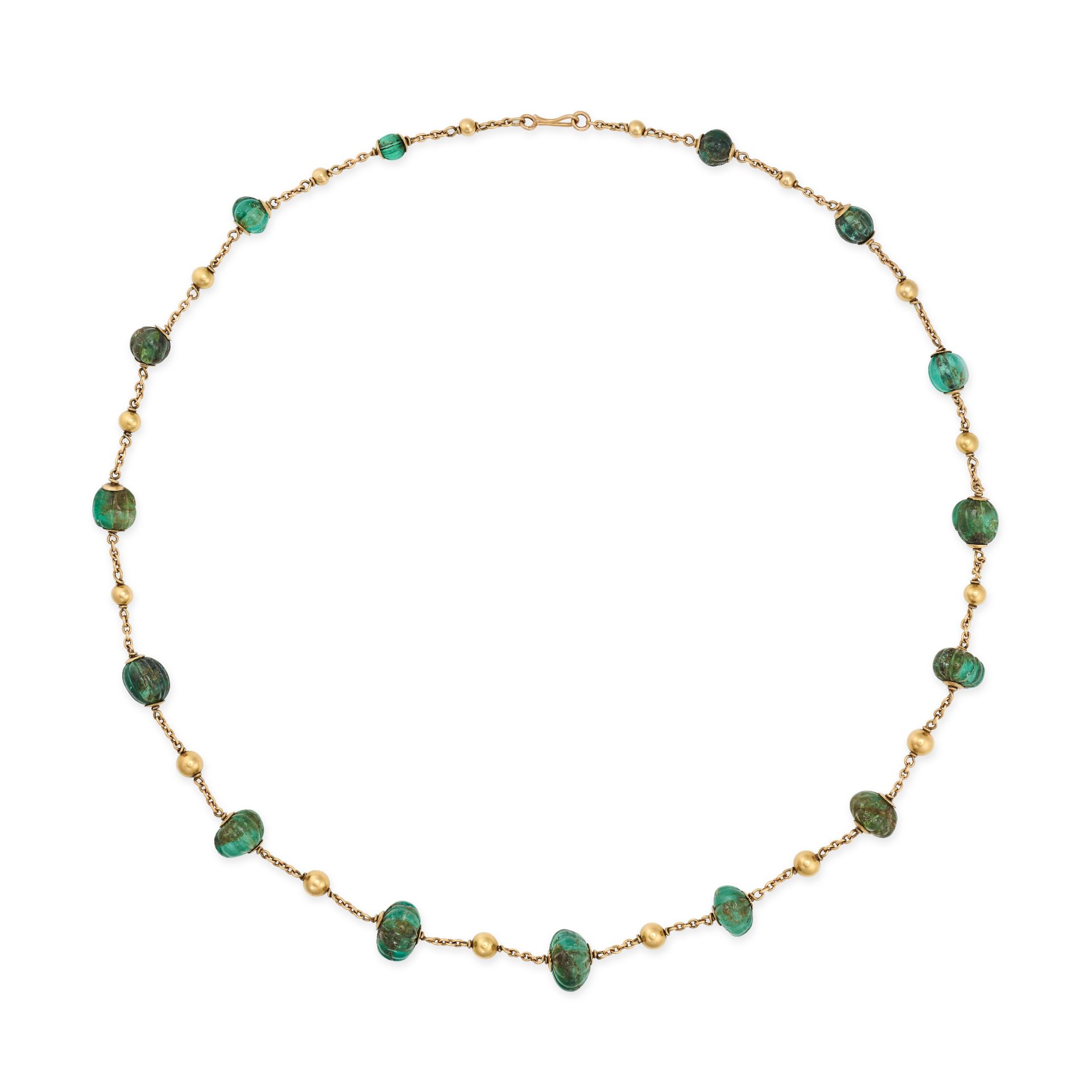 A FRENCH EMERALD SAUTOIR NECKLACE in 18ct yellow gold, set with carved emerald beads, accented by...