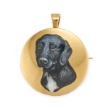 AN ENAMEL DOG BROOCH / PENDANT in 18ct yellow gold, the circular gold pendant decorated with an e...