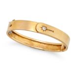 AN ANTIQUE VICTORIAN DIAMOND HALLEY'S COMET BANGLE in yellow gold, the hinged bangle designed wit...