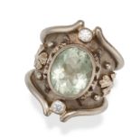 ELIZABETH GAGE, A PRASIOLITE AND DIAMOND HELIOTROPE RING in 18ct white gold, set with an oval cut...