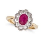 A RUBY AND DIAMOND CLUSTER RING in 18ct yellow gold, set with an oval cut ruby of approximately 0...