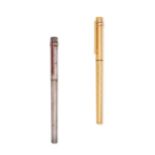 CARTIER, TWO MUST DE CARTIER STYLOS PENS one a gold plated fountain pen with 18ct yellow gold nib...