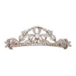 AN ANTIQUE DIAMOND BROOCH in 14ct yellow and white gold, of ribbon and floral design, set through...