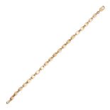 CARTIER, A GOLD BRACELET in 18ct yellow gold, comprising a row of fancy links, signed Cartier, st...