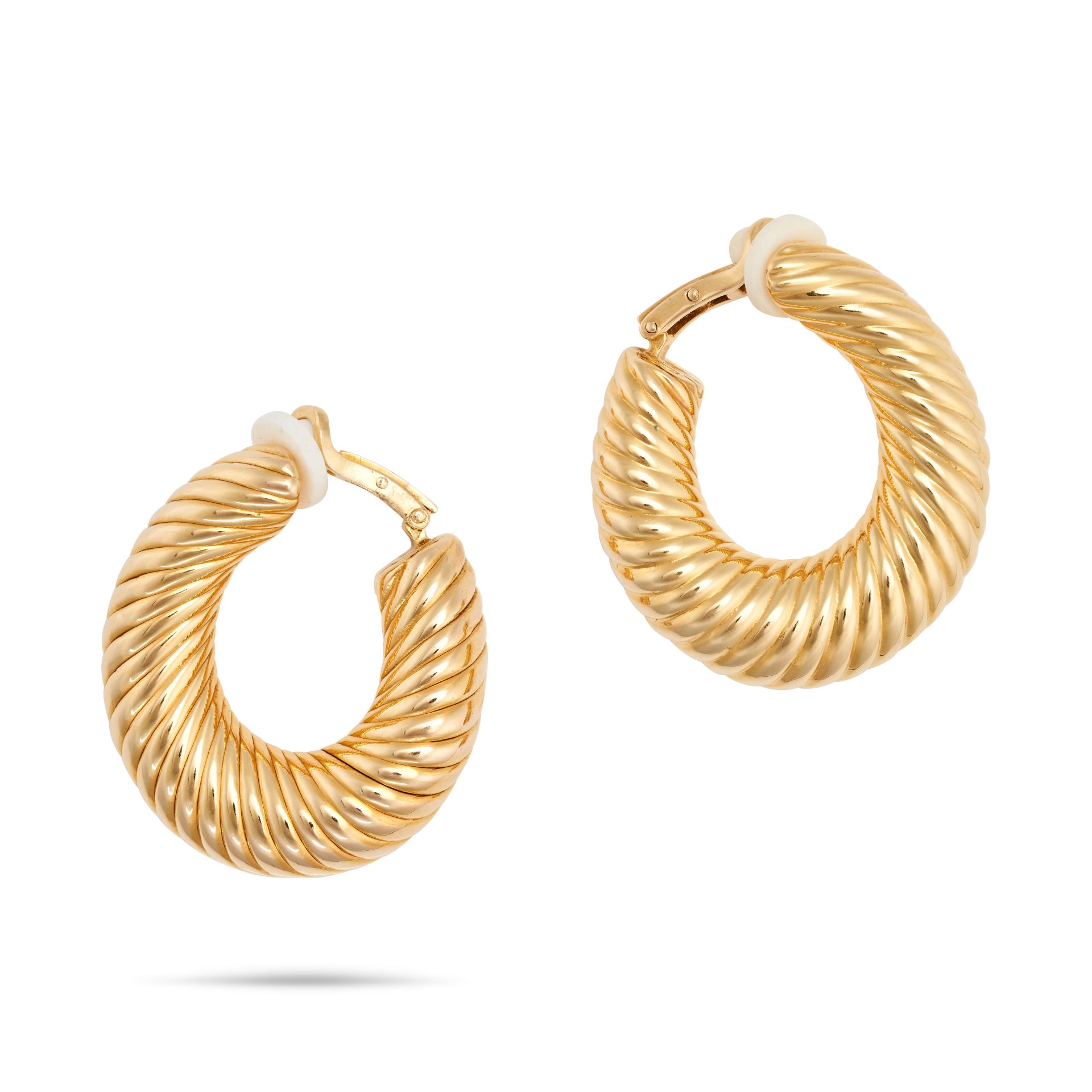 VAN CLEEF & ARPELS, A PAIR OF GOLD HOOP EARRINGS in 18ct yellow gold, each designed as a fluted h...