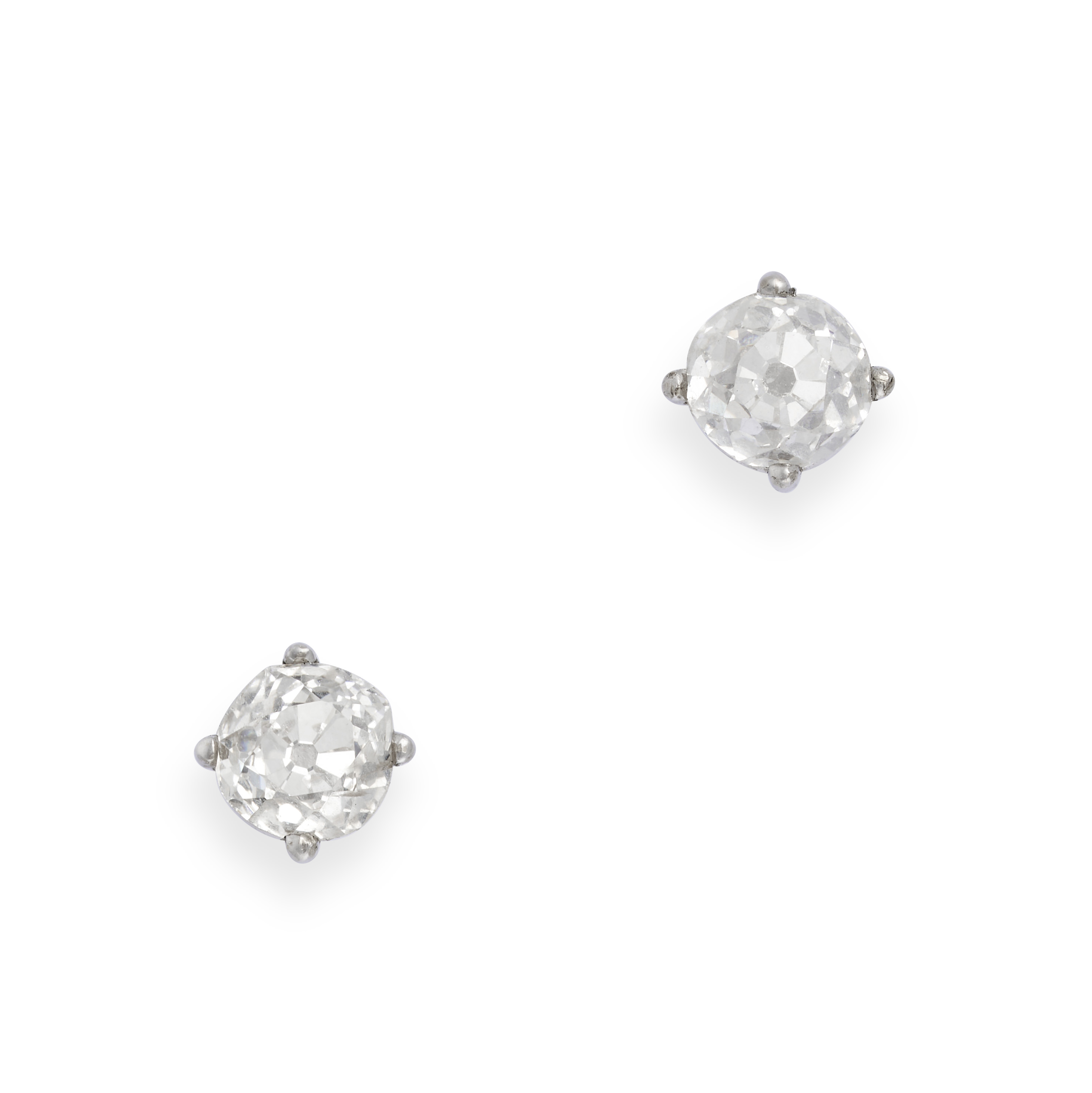 A PAIR OF DIAMOND STUD EARRINGS in white gold, each set with an old cut diamond of approximately ...