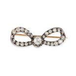 AN ANTIQUE AUSTRIAN DIAMOND BOW BROOCH in yellow gold and silver, set throughout with old cut dia...
