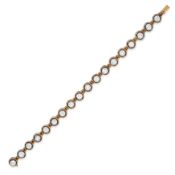 A DIAMOND LINE BRACELET in yellow gold and silver, comprising a row of rose cut diamonds, no assa...