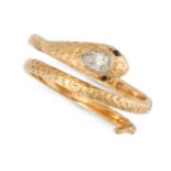 AN ANTIQUE DIAMOND AND GARNET SNAKE RING in 18ct yellow gold, designed as an engraved coiled snak...
