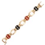 TIFFANY & CO., A RETRO ONYX AND CARNELIAN BRACELET, CIRCA 1940 in 14ct yellow gold, comprising a ...