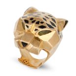 CARTIER, A PERIDOT, ONYX AND ENAMEL PANTHERE RING in 18ct yellow gold, designed as the head of a ...