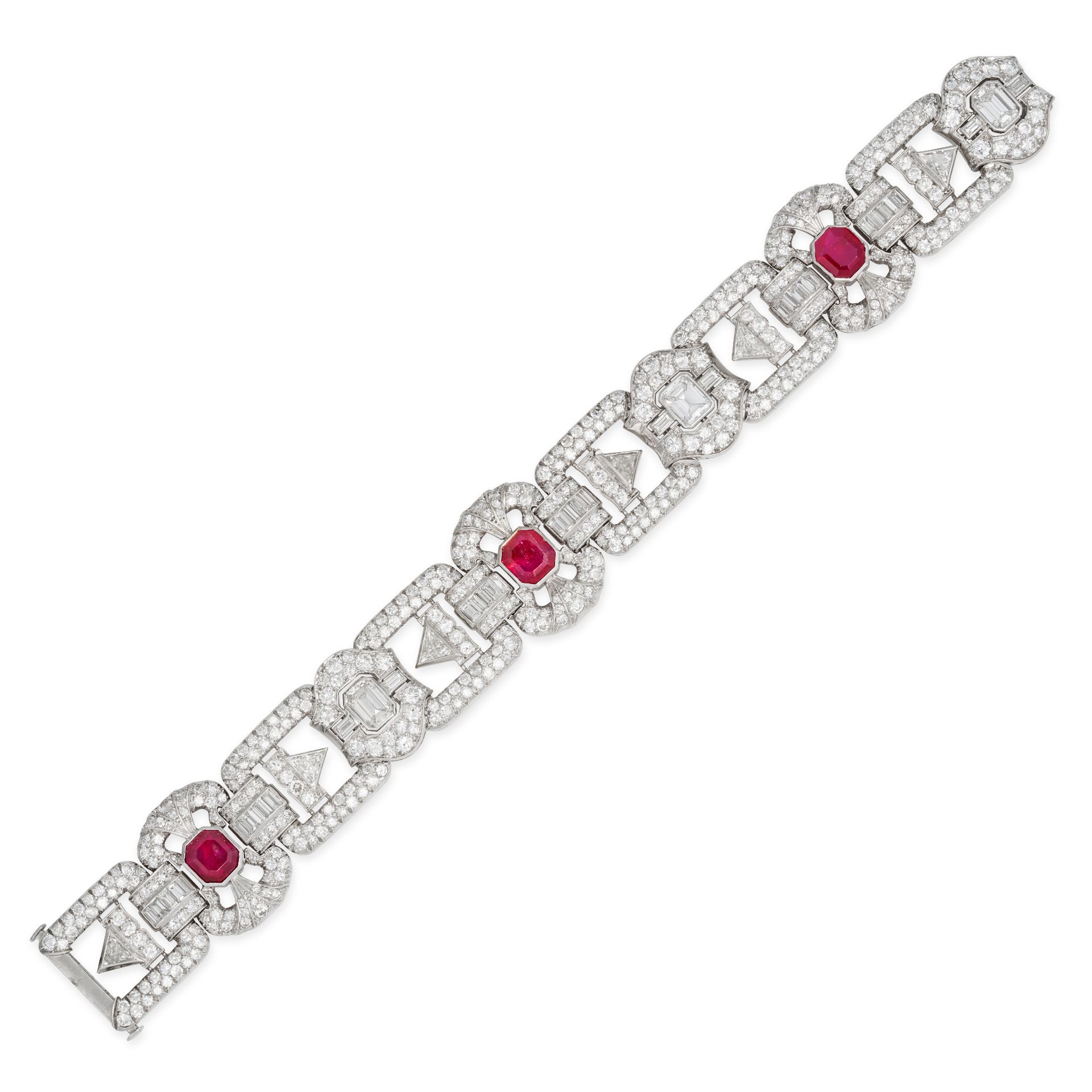 A FINE BURMA NO HEAT RUBY AND DIAMOND BRACELET, CIRCA 1940 in white gold and platinum, comprising...
