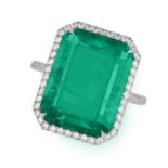 A VERY FINE COLOMBIAN EMERALD AND DIAMOND RING in platinum, set with an octagonal step cut emeral...