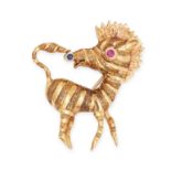 CARTIER, A VINTAGE RUBY AND SAPPHIRE ZEBRA BROOCH in 18ct yellow gold, designed as a zebra, the e...