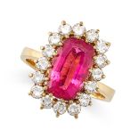 A VINTAGE PINK TOURMALINE AND DIAMOND CLUSTER RING, CIRCA 1985 in yellow gold, set with a cushion...