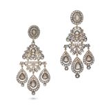 A PAIR OF DIAMOND PENDENT EARRINGS in yellow gold and silver, each set with a rose cut diamond in...