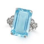 NO RESERVE - A BLUE GLASS AND DIAMOND RING in white gold, set with an octagonal step cut glue gla...