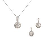NO RESERVE - A DIAMOND NECKLACE AND EARRINGS SUITE in 18ct white gold, the pendant set with a rou...