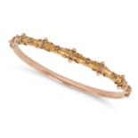 AN ANTIQUE VICTORIAN ETRUSCAN REVIVAL GOLD BANGLE in 9ct yellow gold, the hinged bangle accented ...