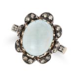 A MOONSTONE AND DIAMOND RING in 18ct yellow gold and silver, set with an oval cabochon moonstone ...
