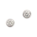 A PAIR OF DIAMOND STUD EARRINGS in 18ct white gold, each set with a round brilliant cut diamond, ...