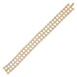 A DIAMOND BRACELET in 18ct yellow gold, set with three rows of round brilliant cut diamonds, the ...