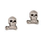 RALPH LAUREN, A PAIR OF DIAMOND SKULL CUFFLINKS in 18ct white gold, each designed as a skull, the...