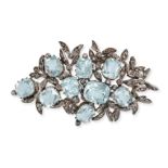 AN AQUAMARINE AND DIAMOND BROOCH in yellow gold and silver, in foliate design set with cushion cu...