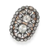 A DIAMOND DRESS RING in yellow gold and silver, the oval face set throughout with old cut diamond...