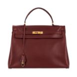 HERMÈS VINTAGE BURGUNDY KELLY 35 BAG Condition grade C.  35cm long, 25cm high. Top handle drop ...