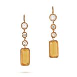 A PAIR OF DIAMOND AND YELLOW SAPPHIRE DROP EARRINGS in yellow gold, each comprising a row of thre...