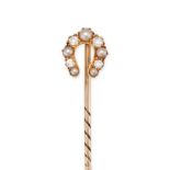 AN ANTIQUE PEARL AND DIAMOND HORSESHOE STICK PIN in yellow gold, the horseshoe set with alternati...