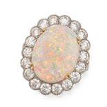 AN OPAL AND DIAMOND CLUSTER RING in yellow gold, set with a cabochon opal of approximately 6.00 c...