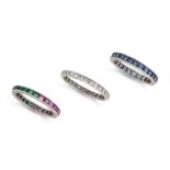 NO RESERVE - A SET OF THREE GEMSET ETERNITY RINGS one set all around with a row of rectangular st...