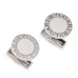 BULGARI, A PAIR OF CUFFLINKS in 18ct white gold, each comprising an engine turned disc in a borde...