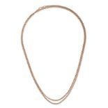 AN ANTIQUE GOLD GUARD CHAIN NECKLACE in 9ct yellow gold, comprising a belcher link chain terminat...
