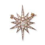 AN ANTIQUE DIAMOND STAR BROOCH / PENDANT in yellow gold and silver, designed as a twelve rayed st...